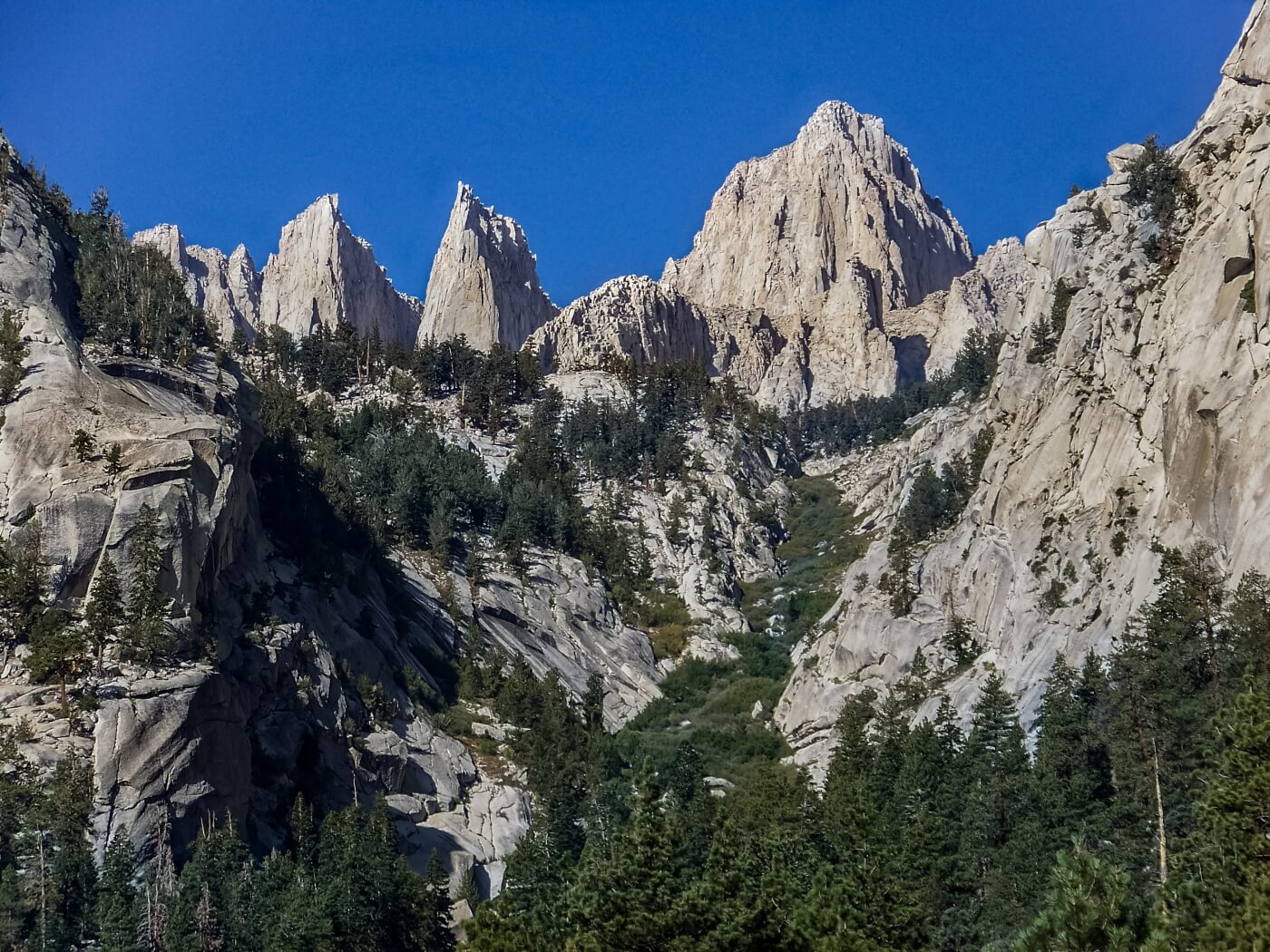 Granite spires of Inyo National Forest against clear blue sky
