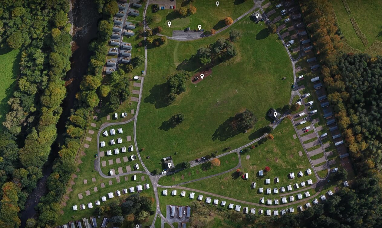 Aerial view of Blair Castle Caravan Park beside the river.