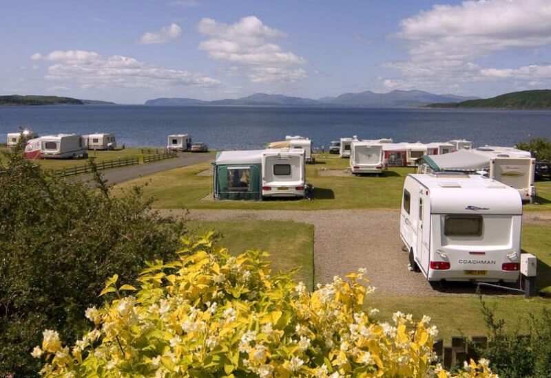 Touring pitches with sea views at North Ledaig Caravan Park.